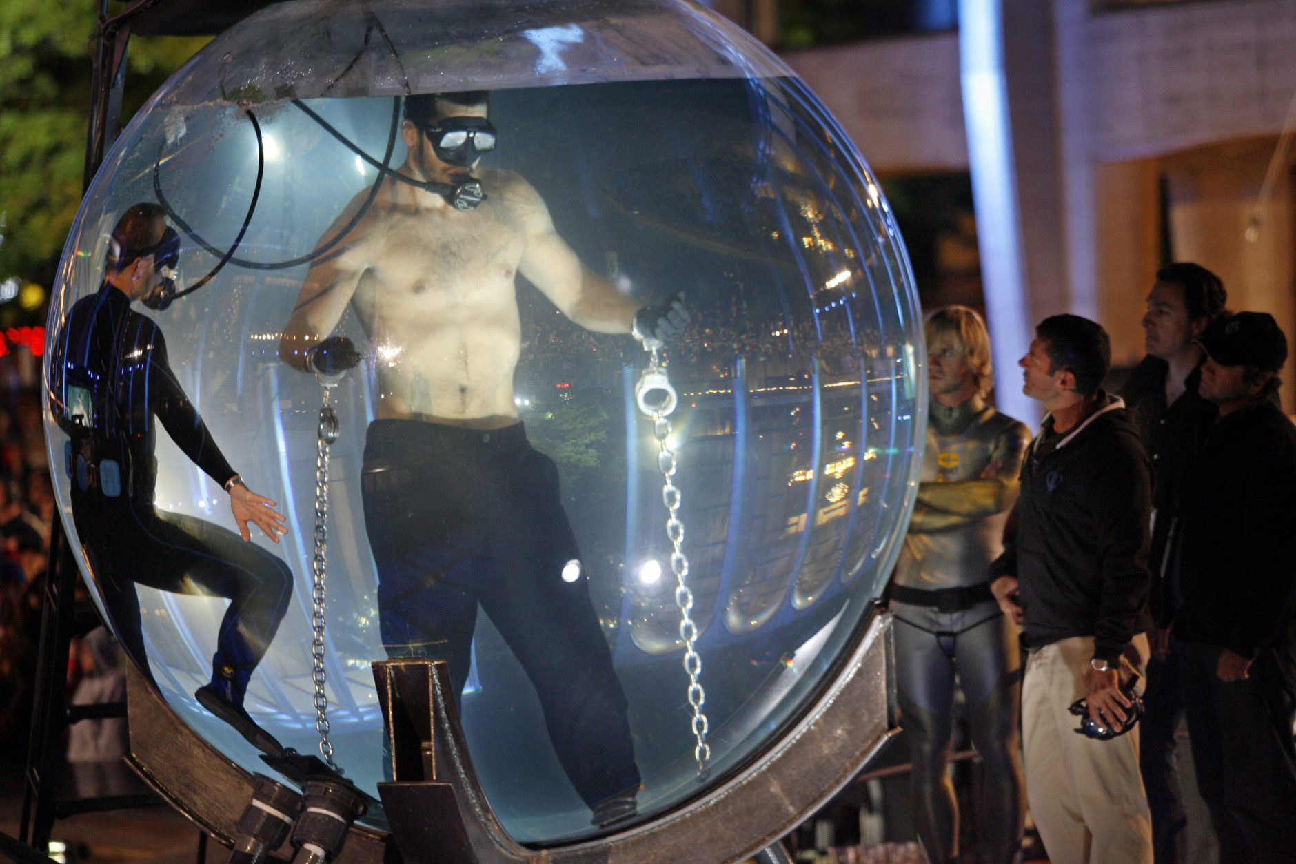 A diver makes a final inspection after chaining David Blaine in his water sphere, before Blaine's attempt to break the world record by submerging in water for nine minutes, New York, Monday, May 8, 2006. Blaine was pulled out of the sphere at the seven minute, eight second mark. (AP Photo/Stuart Ramson)