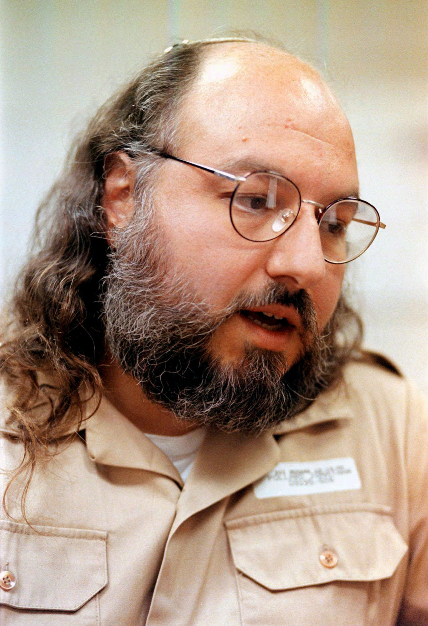 FILE - In this May 15, 1998 file photo, Jonathan Pollard speaks during an interview in a conference room at the  Federal Correction Institution in Butner, N.C. The U.S. Bureau of Prisons says convicted Israeli spy Jonathan Jay Pollard has been hospitalized at a prison medical center in Butner, N.C., since April 4.  (AP Photo/ Karl DeBlaker, File)