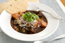 In this image taken on January 7, 2013, Mexican beef brisket and winter squash chili is shown served in a bowl in Concord, N.H. (AP Photo/Matthew Mead)