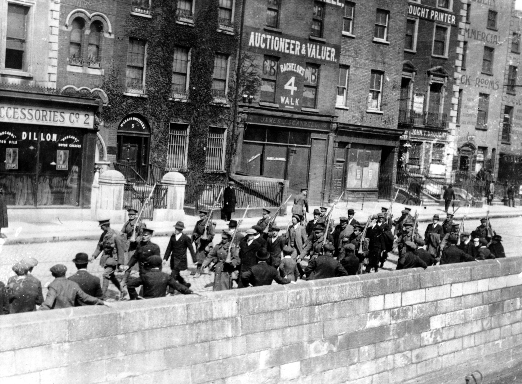 Irish prisoners march along a Dublin quay under a  British guard during the bloody Irish Insurrection that began on Easter Monday, April 24, 1916, in Dublin, Ireland.  Thousands were killed and injured in the revolt.  Ten days later Patrick Pearse, Commandant General of 1,500 Irishmen who threw down an armed challenge, was dead and 14 of his comrades took their turn before the British firing squads. Many more thousands were made prisoners in the Easter Rising. (AP Photo)