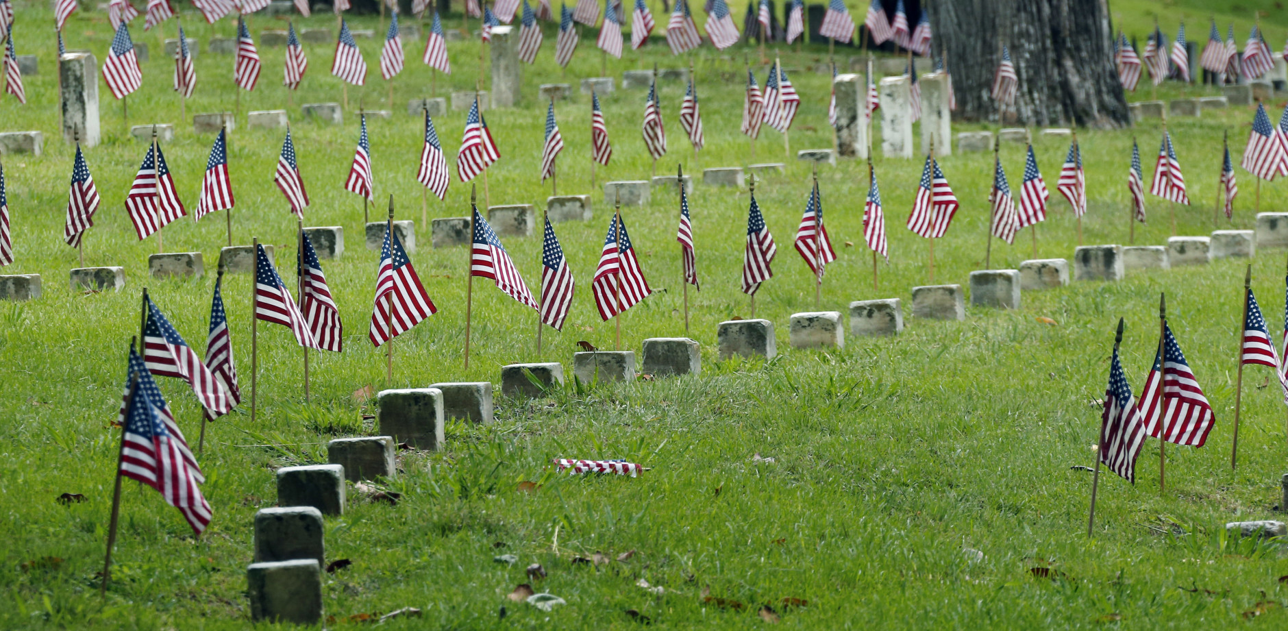 American flags decorate unmarked graves of American servicemen at the Vicksburg National Cemetery, Friday, May, 27, 2016, in Vicksburg, Miss., in advance of the Memorial Day weekend. (AP Photo/Rogelio V. Solis)