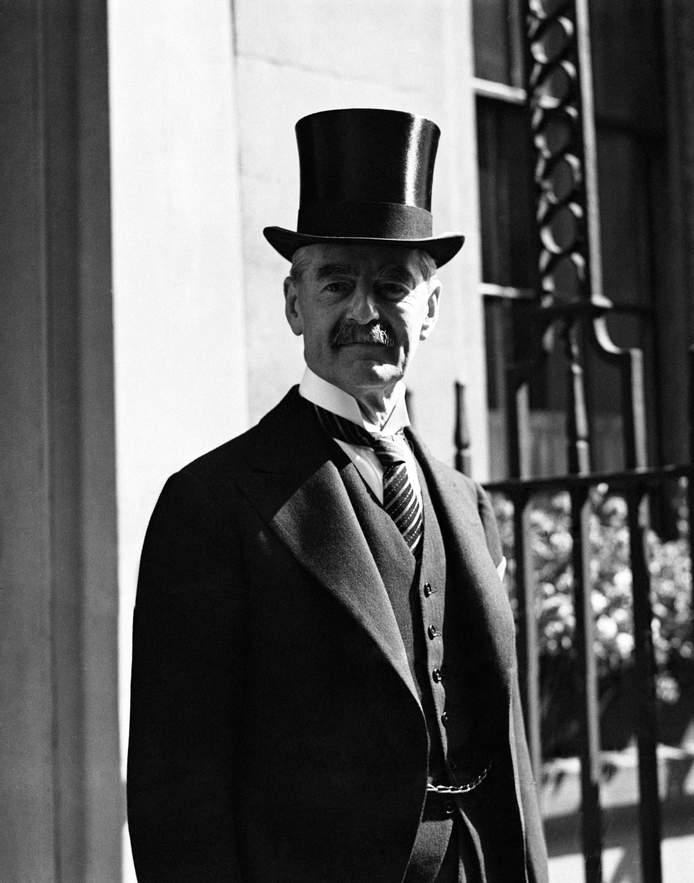 Neville Chamberlain, Chancellor of the Exchequer photographed returning to No. 11 Downing Street, London after he had an audience with King George VI on the day that Stanley Baldwin resigned as Prime Minister on May 28, 1937. It is expected that he will become the new Prime Minister of Britain. (AP Photo/Staff/Putnam)
