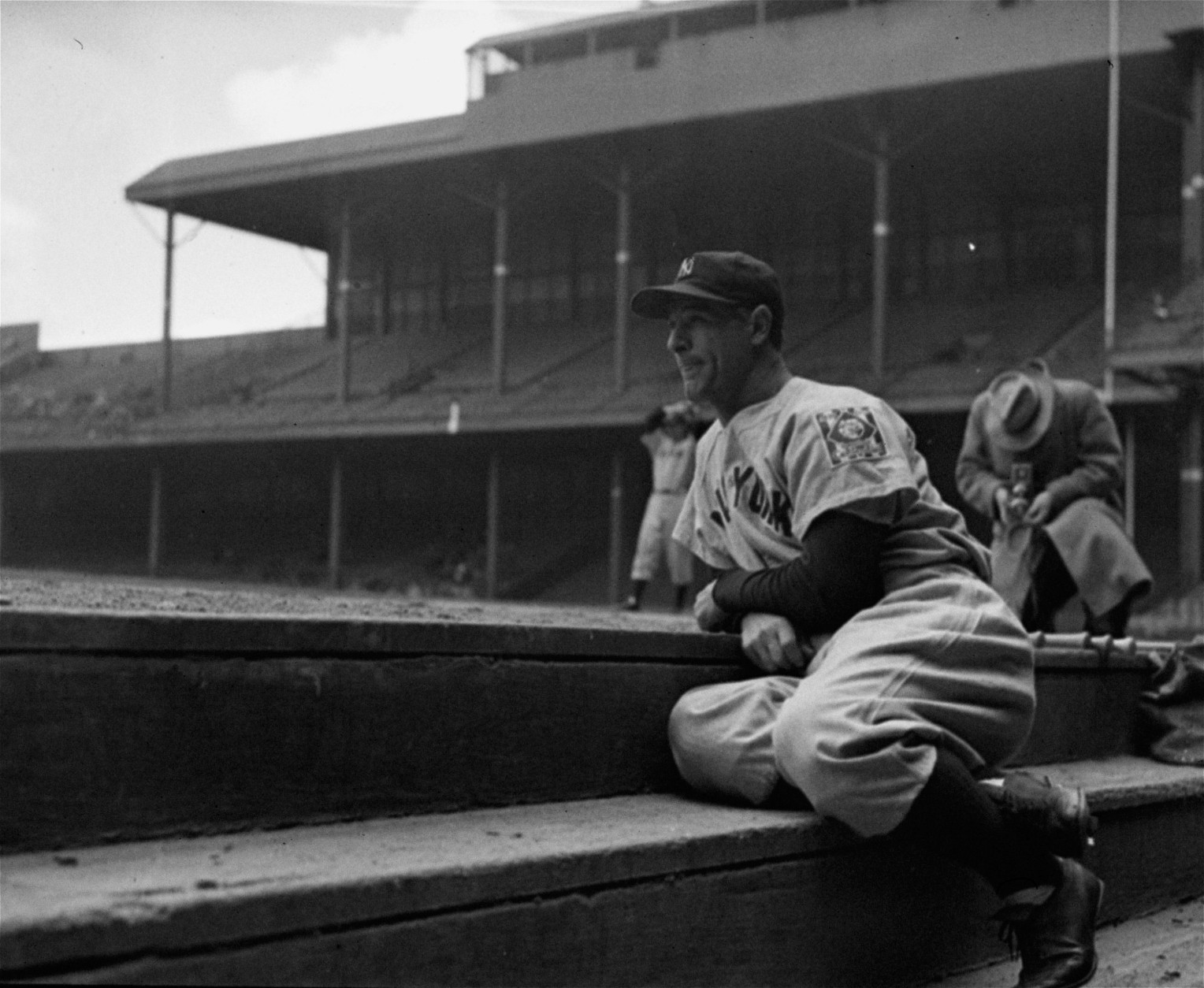 Lou Gehrig, New York Yankees first baseman who had played in 2,130 consecutive games, took to the bench May 2, 1939 at his own request and looked on forlornly as his teammates warmed up for their game with the Tigers in Detroit.  "I felt I wasn't helping the club by the way I was playing," Gehrig explained.  The Yankees thrashed the Tigers 22 to 2.  (AP Photo)