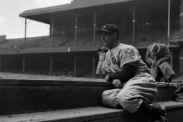 Lou Gehrig, New York Yankees first baseman who had played in 2,130 consecutive games, took to the bench May 2, 1939 at his own request and looked on forlornly as his teammates warmed up for their game with the Tigers in Detroit.  "I felt I wasn't helping the club by the way I was playing," Gehrig explained.  The Yankees thrashed the Tigers 22 to 2.  (AP Photo)