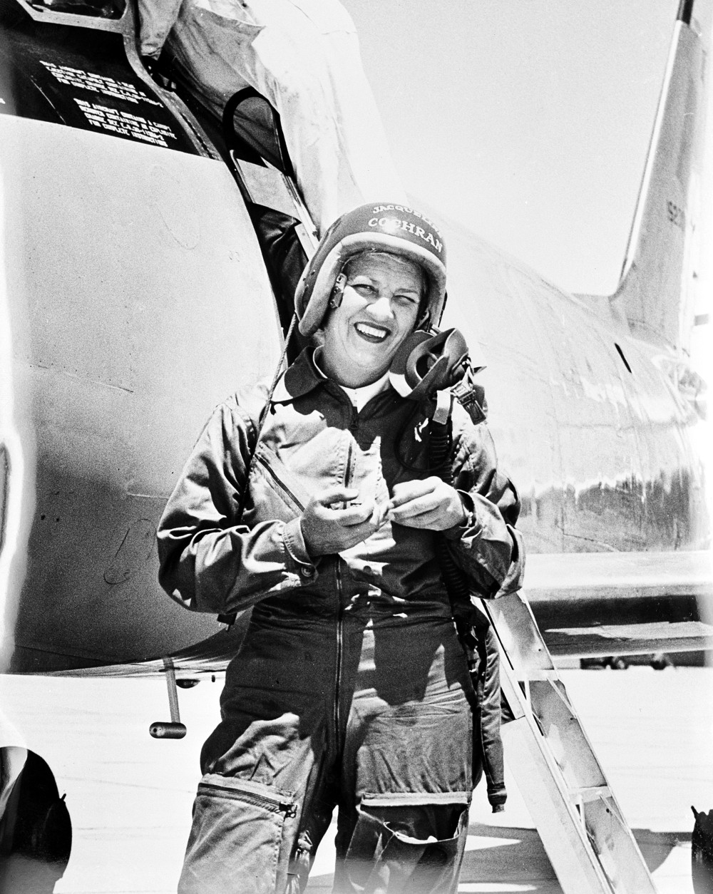 Jacqueline Cochran stands in front of the Canadian-built F-86 Sabre jet, in which she became the first woman to break the sound barrier, at Edwards Air Force Base, Ca., May 19, 1953. Cochran made history on May 18, flying at a speed of 625.5 miles per hour.  (AP Photo)