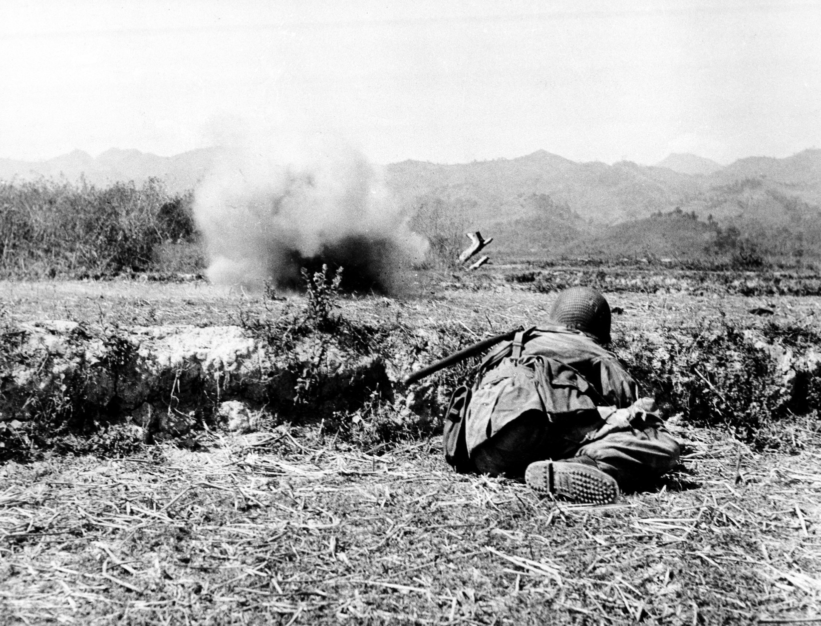 Soldiers of the French-Indochinese Union army, defending the French garrison and stronghold of Dien Bien Phu, are under heavy attack by the Communist Viet Minh forces firing from their positions in the mountains across, on March 24, 1954.  (AP Photo)