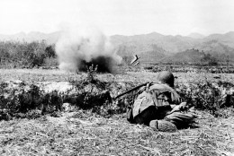 Soldiers of the French-Indochinese Union army, defending the French garrison and stronghold of Dien Bien Phu, are under heavy attack by the Communist Viet Minh forces firing from their positions in the mountains across, on March 24, 1954.  (AP Photo)