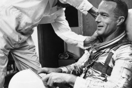 Astronaut Scott Carpenter gets a final going over from a suit technician as he prepares for orbital flight at Cape Canaveral, Florida, May 24, 1962. (AP Photo)