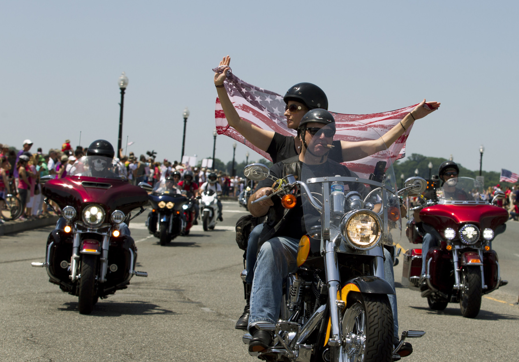 Participants in the Rolling Thunder annual motorcycle rally ride past Arlington memorial bridge during the parade ahead of Memorial Day in Washington, Sunday, May 24, 2015.  (AP Photo/Jose Luis Magana)