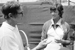 Bobby Riggs, former Wimbledon tennis star, talks with Margaret Court about heavy duty tennis ball she has selected for their $10,000 challenge match in Ramona, Calif., May 12, 1973. She won a coin toss on Thursday and selected the heavier ball. Riggs attempted to talk Margaret into using a livelier ball in their best-of-three set match. Margaret stuck with her original decision. (AP Photo/Wally Fong)