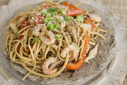In this image taken on January 14, 2013, shrimp and shitake noodle stir-fry is shown served in a bowl in Concord, N.H. (AP Photo/Matthew Mead)