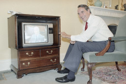 Senate Majority Leader Sen. Bob Dole of Kansas watches Sen. Charles McC. Mathias Jr. on television during a Senate floor debate, from his office on Capitol Hill, Washington, Monday, June 2, 1986. The Senate launched a six-week experiment of making its floor sessions available for live broadcast by television networks. (AP Photo/Lana Harris)