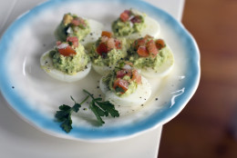 This July 22, 2013 photo shows a recipe for Mexican style stuffed eggs. (AP Photo/Matthew Mead)