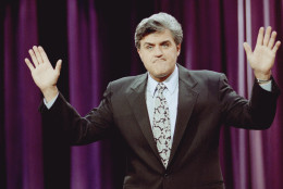 Jay Leno gestures during the opening monologue at the inauguration of "The Tonight Show with Jay Leno" which was broadcast live on the east coast from NBC Studios in Burbank, Calif., May 25, 1992. The show features a new band with jazz musician Branford Marsalis as musical director. Leno's first guests were comedian Billy Crystal and singer Shanice. (AP Photo/Craig Fujii)