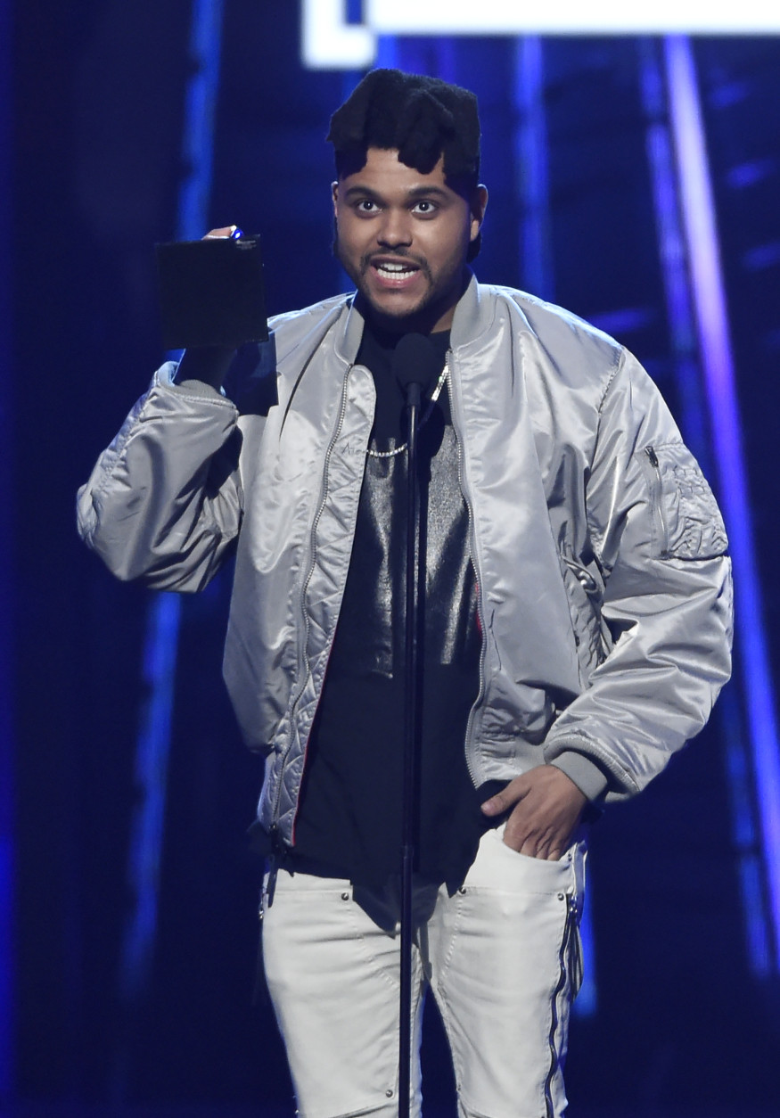 The Weeknd accepts the top 100 artist award at the Billboard Music Awards at the T-Mobile Arena on Sunday, May 22, 2016, in Las Vegas. (Photo by Chris Pizzello/Invision/AP)