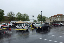 Montgomery County police investigate the death of a woman who was shot in the parking lot of a Giant grocery store on Connecticut Avenue in Aspen Hill Friday, May 6. (WTOP/Kristi King)