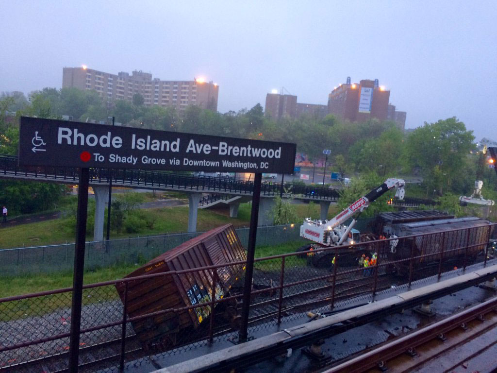 The wreckage from Sunday's derailment litters the tracks under the Rhode Island Avenue Metro Station on Monday morning. (WTOP/Nick Iannelli)