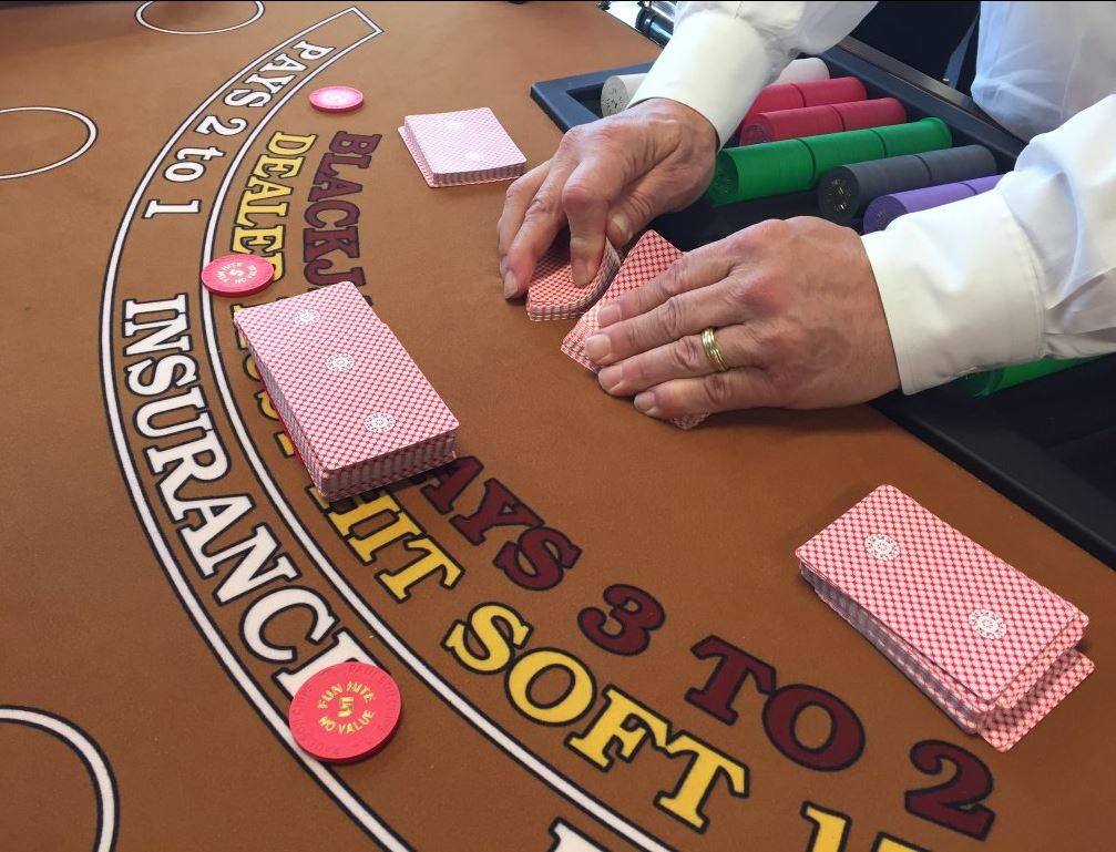 Here, potential dealers learn proper card shuffling. (WTOP/Michelle Basch)