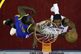 CLEVELAND, OH - JUNE 16:  Tristan Thompson #13 of the Cleveland Cavaliers shoots against Draymond Green #23 of the Golden State Warriors during Game Six of the 2015 NBA Finals at Quicken Loans Arena on June 16, 2015 in Cleveland, Ohio. NOTE TO USER: User expressly acknowledges and agrees that, by downloading and or using this photograph, user is consenting to the terms and conditions of Getty Images License Agreement.  (Photo by Tony Dejak Pool/Getty Images)