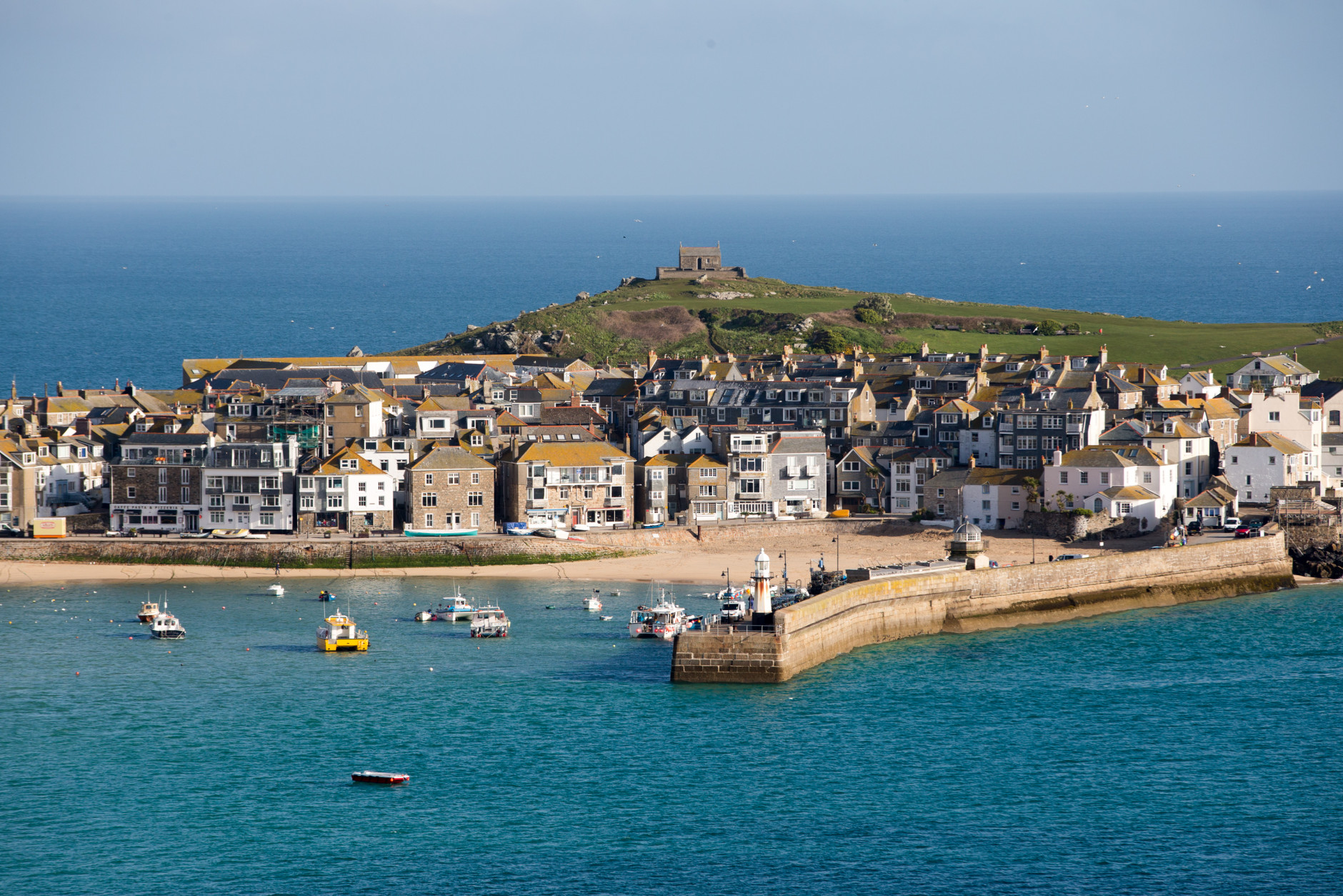 ST IVES, UNITED KINGDOM - APRIL 14:  The morning sun illuminates properties in the popular seaside resort of St Ives on April 14, 2016 in Cornwall, England. Due to the pressures that second and holiday homes are having on the town's housing market the council has asked residents to vote in a referendum on May 5 on a new town plan which includes a promise to restrict second home ownership. If the vote is passed on May 5, all new housing developments will only get permission if the homes are to be reserved by people to live in full time. People whose main residence is elsewhere will not be allowed to buy the property.  (Photo by Matt Cardy/Getty Images)