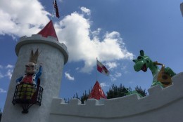 Ole King Cole and a dragon look down from the top of the castle. The king is a replica of the one that still stands atop a pole at the Enchanted Forest Shopping Center, which is the original site of the amusement park. (WTOP/Michelle Basch)