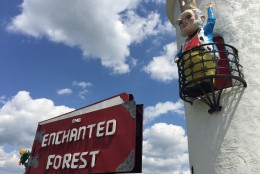 Ole King Cole waves near the amusement park sign. (WTOP/Michelle Basch)