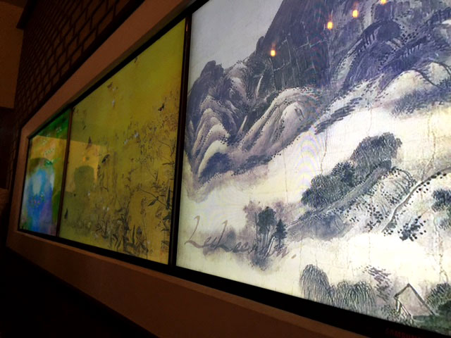 Artwork is displayed through a digital slideshow in the Korean Embassy during the Embassy Tour in D.C. on Saturday, May 7, 2016. (WTOP/Dennis Foley)