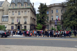 Long lines form as people wait to enter embassies participating in the Embassy Tour in D.C. on Saturday, May 7, 2016. (WTOP/Dennis Foley)