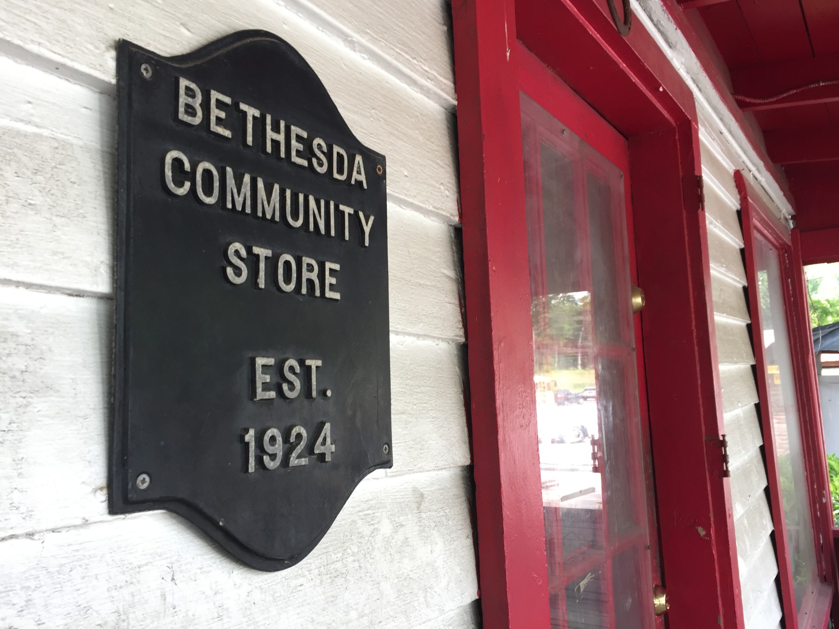 A plaque next to the front door indicates the tiny eatery's age. (WTOP/Michelle Basch)