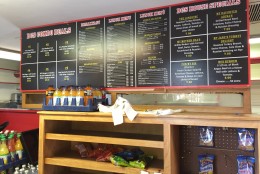 Here's a last look at the menu board inside the Bethesda Community Store & Deli. The store served its last customers Monday before closing. (WTOP/Michelle Basch)