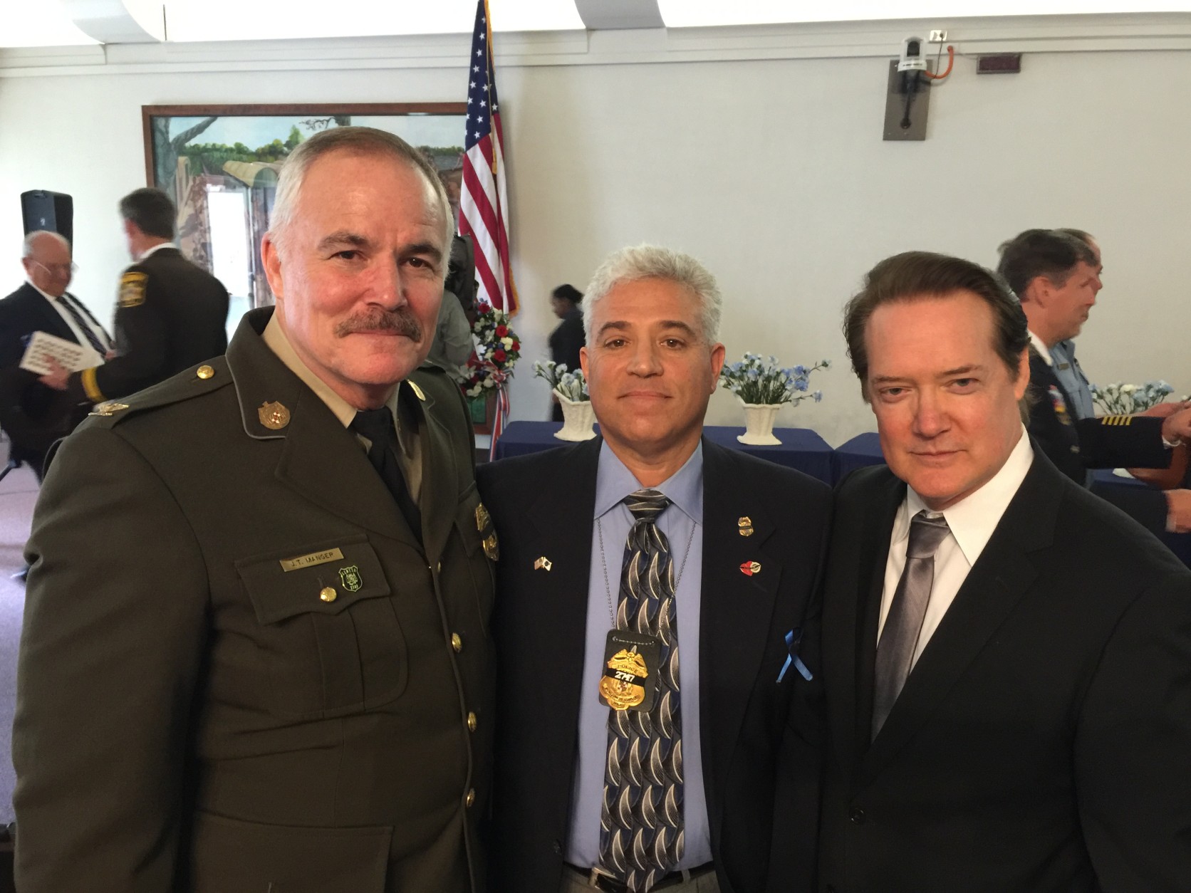 "It was an honor to be part such a poignant ceremony," said WTOP Anchor Shawn Anderson on right who served as emcee of the 37th Annual Washington Area Law Enforcement Officers Memorial Service.  "Whether they were police chiefs...rank and file officers...or family members of the fallen...it was apparent everyone was moved." Pictured with Montgomery County Police Chief Tom Manger with Rich Leotta who is wearing the badge of his son Officer Noah Leotta who was killed by a suspected drunk driver last year. (WTOP/Kristi King)