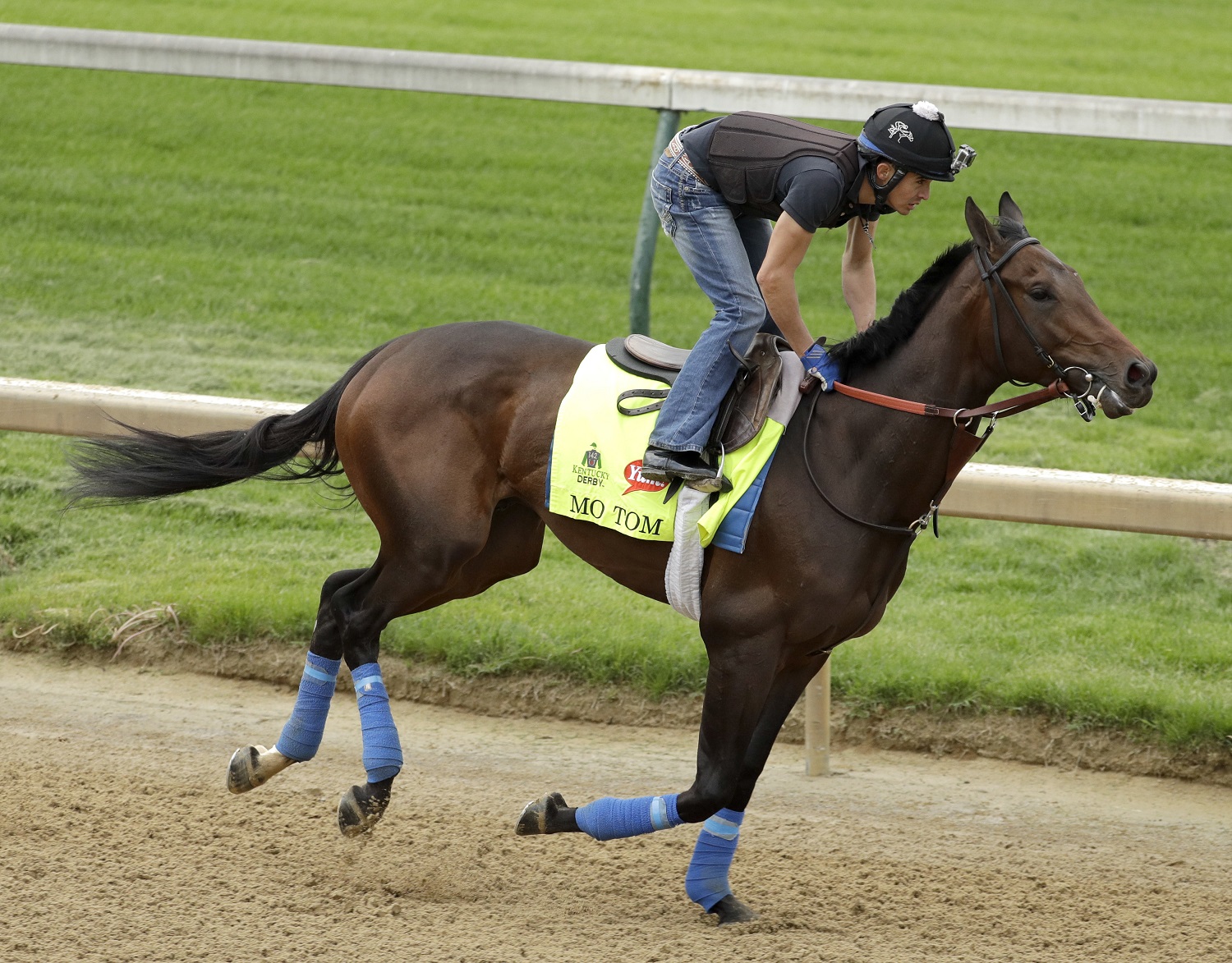 Exercise rider Mario Garcia rides Kentucky Derby hopeful Mo Tom during a workout at Churchill Downs Tuesday, May 3, 2016, in Louisville, Ky. The 142nd running of the Kentucky Derby is scheduled for Saturday, May 7. (AP Photo/Charlie Riedel)