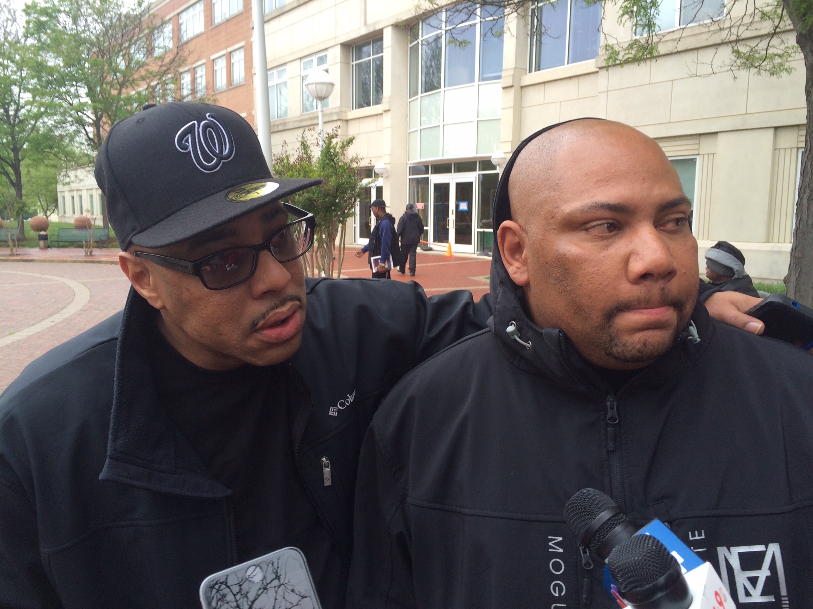 Walter Thompson (right), family member of Det. Joseph Newell, gets emotional speaking about him, Thompson disagrees with the jury's verdict, "It was a murder." (WTOP/John Aaron)