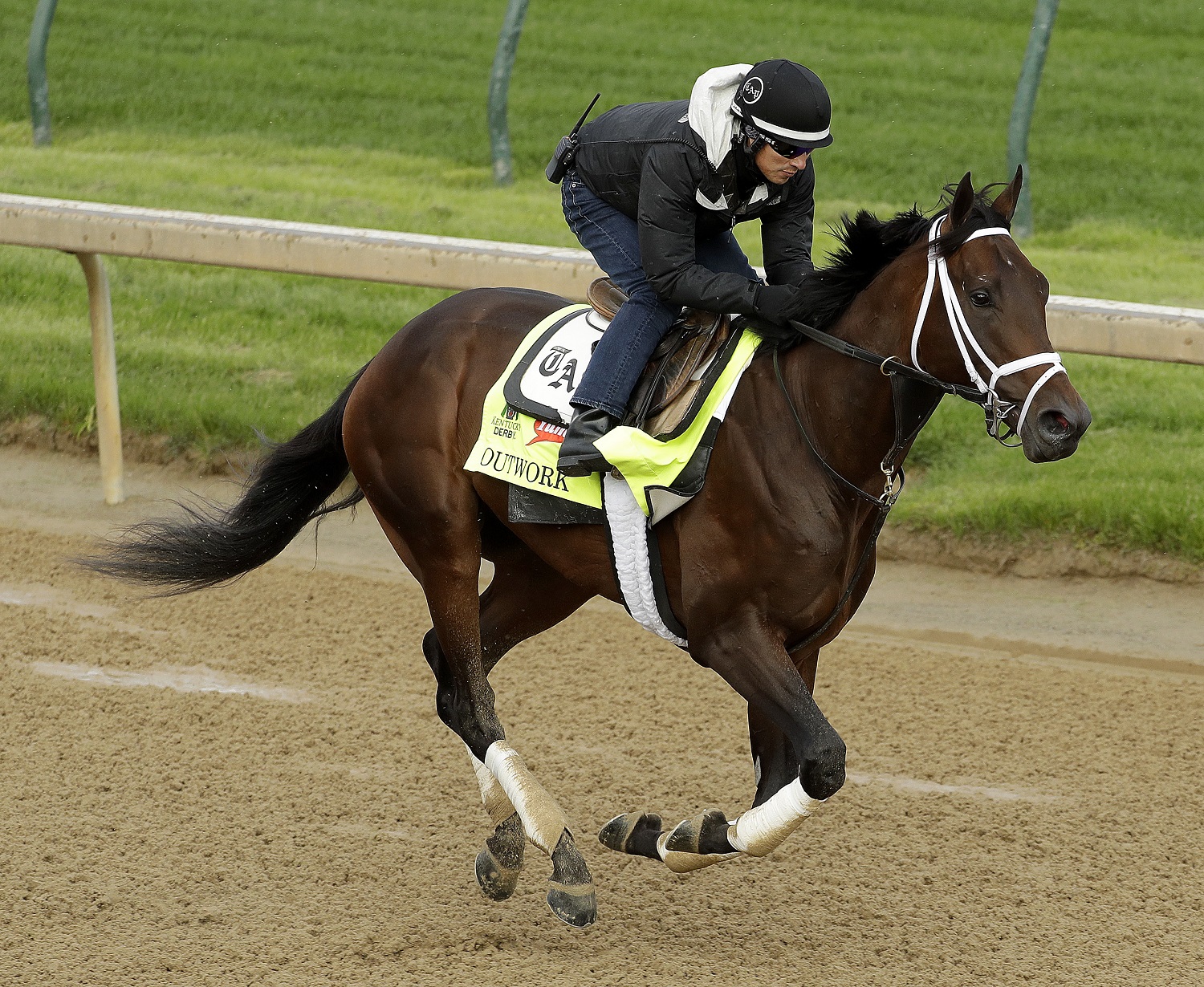 Exercise rider Hector Ramos rides Kentucky Derby entrant Outwork during a workout at Churchill Downs Thursday, May 5, 2016, in Louisville, Ky. The 142nd running of the Kentucky Derby is scheduled for Saturday, May 7. (AP Photo/Charlie Riedel)