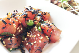 In its simplest version, poke is cubes of raw fish (ahi tuna is the most popular), dressed with shoyu (Hawaiian soy sauce), sesame oil, ginger, onion, chili peppers and seaweed. (WTOP/Rachel Nania)
