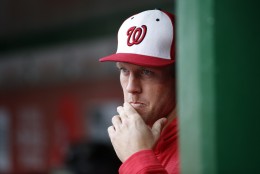 Washington Nationals starting pitcher Stephen Strasburg (37) pauses in the dugout during an exhibition baseball game against the Minnesota Twins at Nationals Park, Saturday, April 2, 2016, in Washington. The game ended in an 8-8 tie. (AP Photo/Alex Brandon)