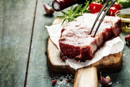Raw beef steak and wine