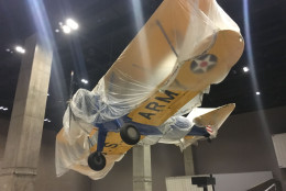 Hung from the ceiling, visitors will see a plane used to train the Tuskegee airmen. (WTOP/Mike Murillo)