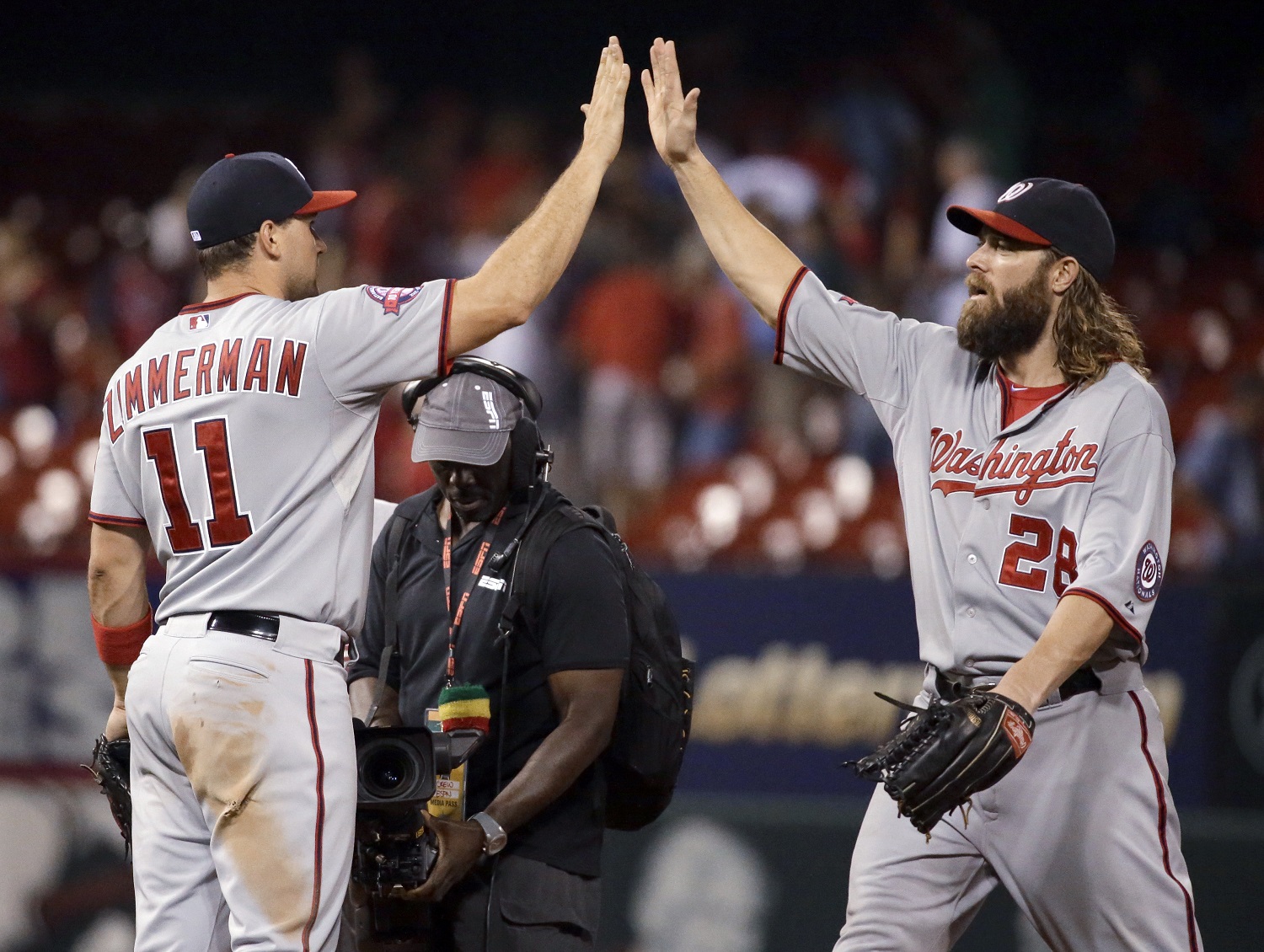 Washington Nationals' Ryan Zimmerman, left, and Jayson Werth celebrate following the Nationals' 4-3 victory over the St. Louis Cardinals in a baseball game Wednesday, Sept. 2, 2015, in St. Louis. (AP Photo/Jeff Roberson)
