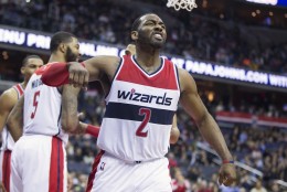 Washington Wizards guard John Wall celebrates a basket against the Philadelphia 76ers during the second half of an NBA basketball game, on Monday, Feb. 29, 2016, in Washington. The Wizards defeated the 76ers 116-108. (AP Photo/Evan Vucci)