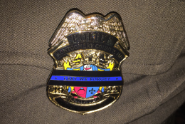 Montgomery County Police Officers wear special badges during
<a href="http://www.policeweek.org/">Police Week</a> when thousands of officers from around the country gather in D.C. to honor fallen comrades. (WTOP/Kristi King)