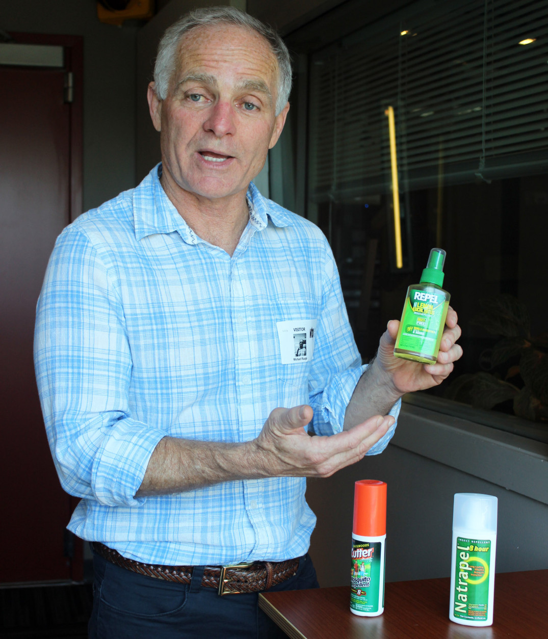 Mike Raupp, professor of entomology at the University of Maryland at College Park, says non-DEET mosquito repellents like this lemon eucalyptus product can effectively protect against Zika-carrying mosquitoes. Raupp visited the Glass Enclosed Nerve Center on Monday, May 2, 2016. (WTOP/Amanda Iacone)