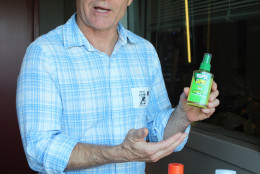 Mike Raupp, professor of entomology at the University of Maryland at College Park, says non-DEET mosquito repellents like this lemon eucalyptus product can effectively protect against Zika-carrying mosquitoes. Raupp visited the Glass Enclosed Nerve Center on Monday, May 2, 2016. (WTOP/Amanda Iacone)
