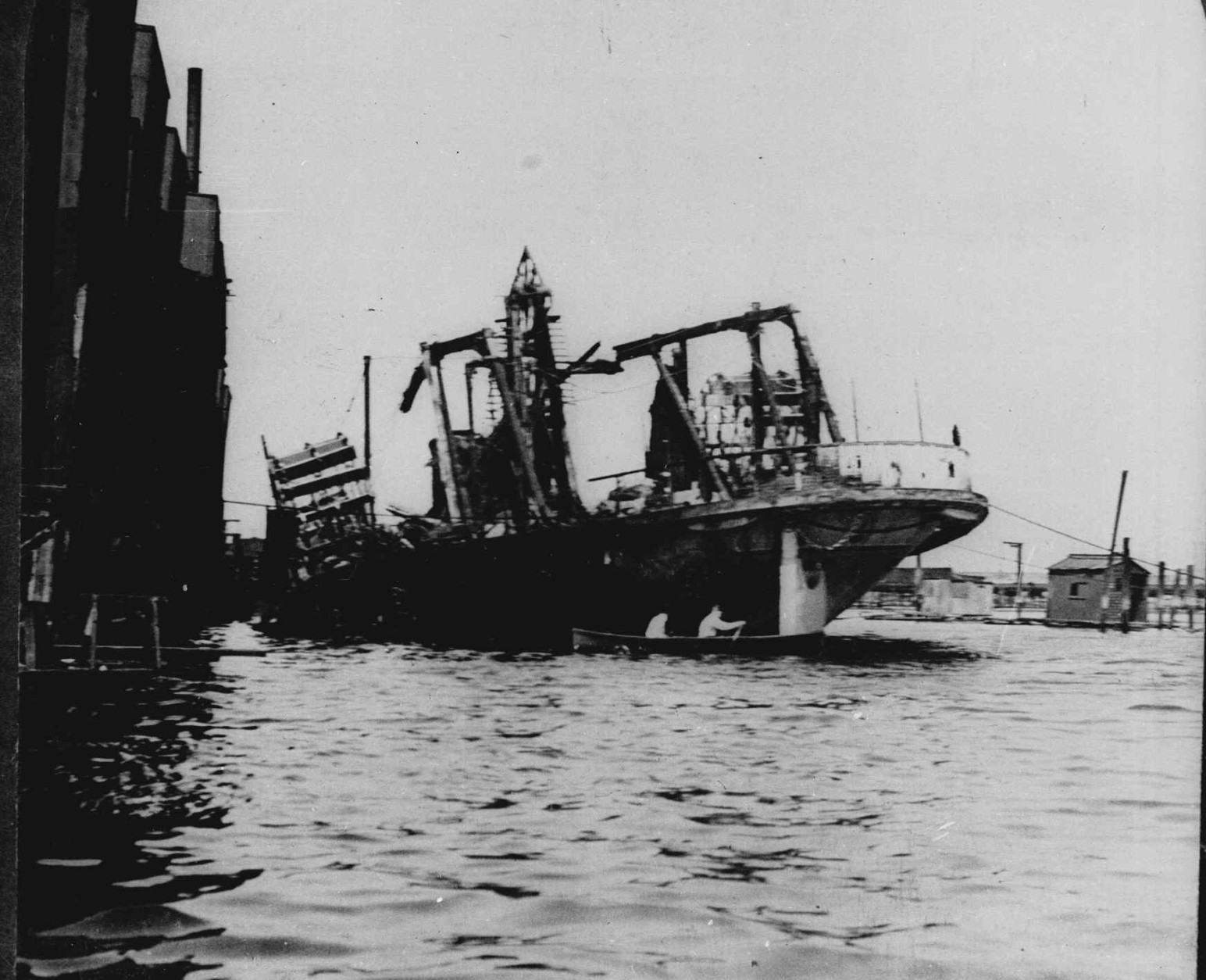 The excursion boat General Slocum lies beached off Hell Gate in New York City's East River, following a fire and resulting panic. The disaster cost the lives of 1,030 mostly German immigrants, June 15, 1904.  (AP Photo)