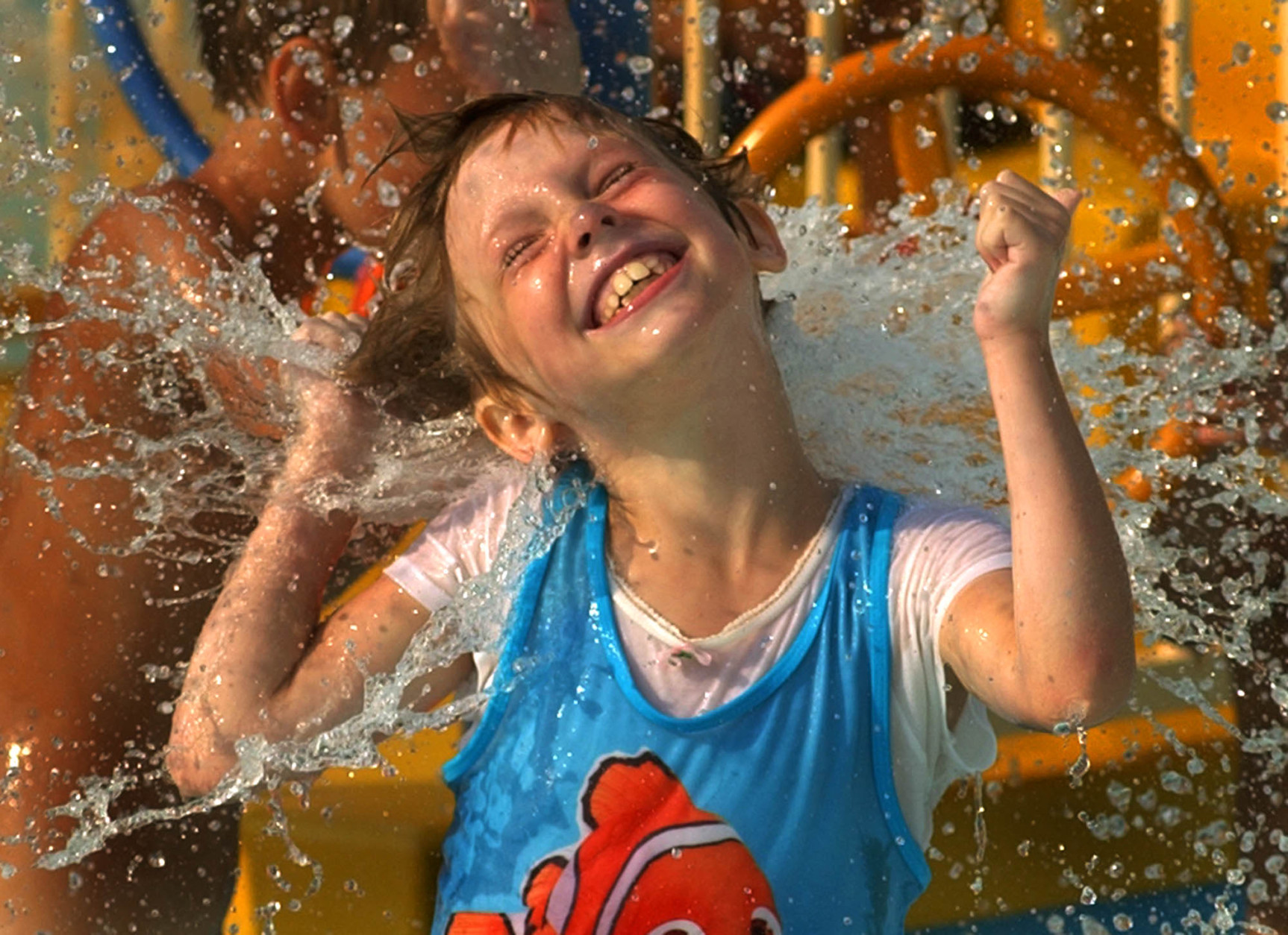 Blair Gratzer, 6, of Pittsburgh, gets in a last splash of summer at Sandcastle water park in West Homestead, Pa., Sunday, Sept. 5, 2004. (AP Photo/Gene J. Puskar)