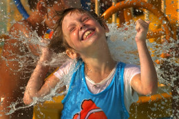 Blair Gratzer, 6, of Pittsburgh, gets in a last splash of summer at Sandcastle water park in West Homestead, Pa., Sunday, Sept. 5, 2004. (AP Photo/Gene J. Puskar)