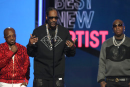 From left, Jermaine Dupri, Snoop Dogg and Birdman present the award for best new artist at the BET Awards at the Microsoft Theater on Sunday, June 26, 2016, in Los Angeles. (Photo by Matt Sayles/Invision/AP)