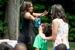 First lady Michelle Obama waves goodbye to school children from across the country after they harvest the White House Kitchen Garden, Monday, June 6, 2016, at the White House in Washington. (AP Photo/Andrew Harnik)