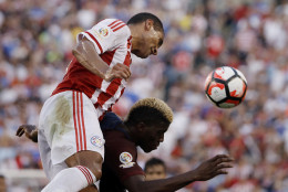 Paraguay's Paulo da Silva, top, and United States' Gyasi Zerdes go up to head the ball during the first half of a Copa America Group A soccer match Saturday, June 11, 2016, in Philadelphia. (AP Photo/Matt Rourke)