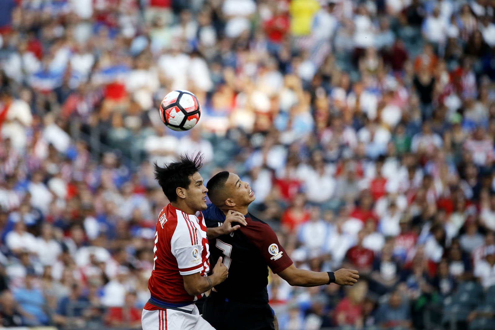 Paraguay's Gustavo Gomez (3) and United States' Bobby Wood (7) go up for the ball during the first half of a Copa America Group A soccer match Saturday, June 11, 2016, in Philadelphia. (AP Photo/Matt Rourke)